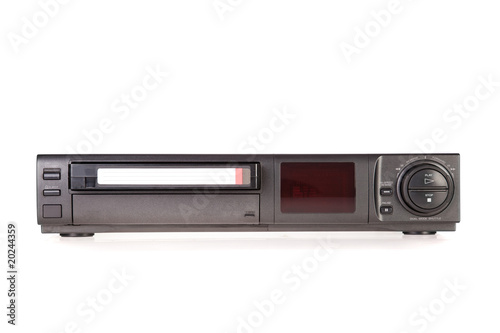 Old Video Cassette Recorder ejecting tape isolated