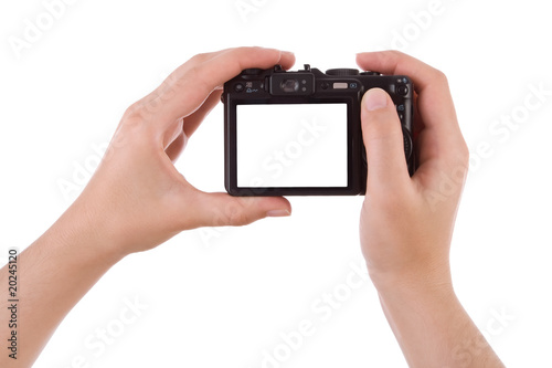 Hand photographing with a digital camera isolated on white