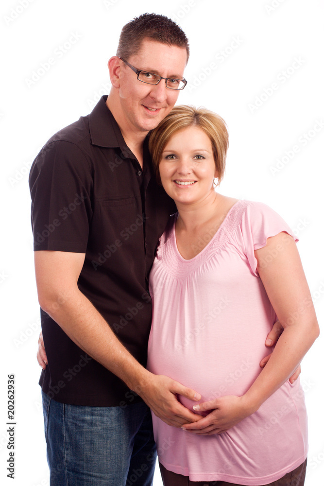 Young pregnant couple in studio isolated on white Young pregnant couple in studio isolated on white