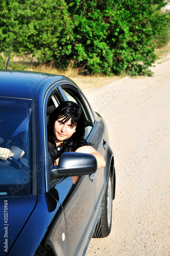 woman driving a car © Elena Stepanova