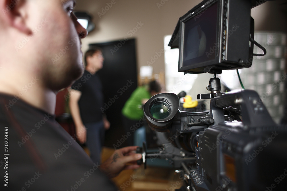 Cameraman operating digital cinema camera