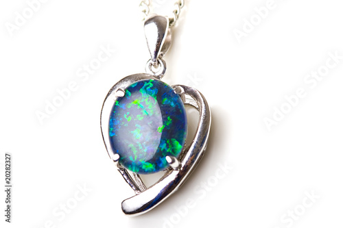 Beautiful jewelry opal stone pendant silver heart shape isolated