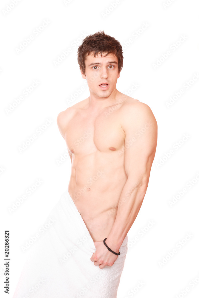 Young, handsome man overwraped by towel