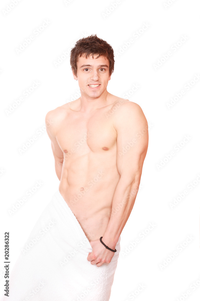 Fototapeta premium Young, handsome man overwraped by towel