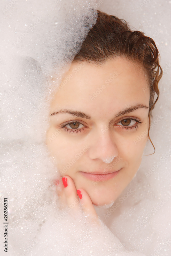 Young woman enjoys bath-foam Young woman enjoys bath-foam