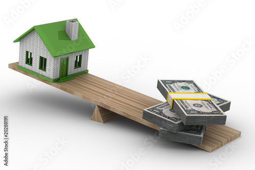 house and money on scales. ...
