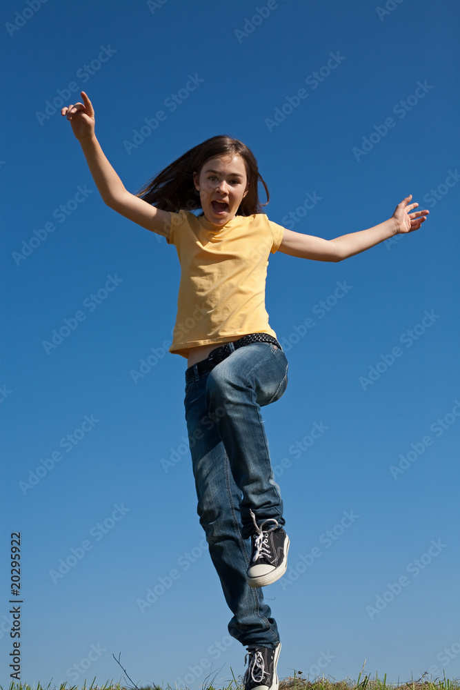 Girl running, jumping against blue sky Girl running, jumping against blue sky