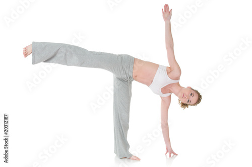 Young woman doing yoga, Half Moon / Ardha Chandrasana position