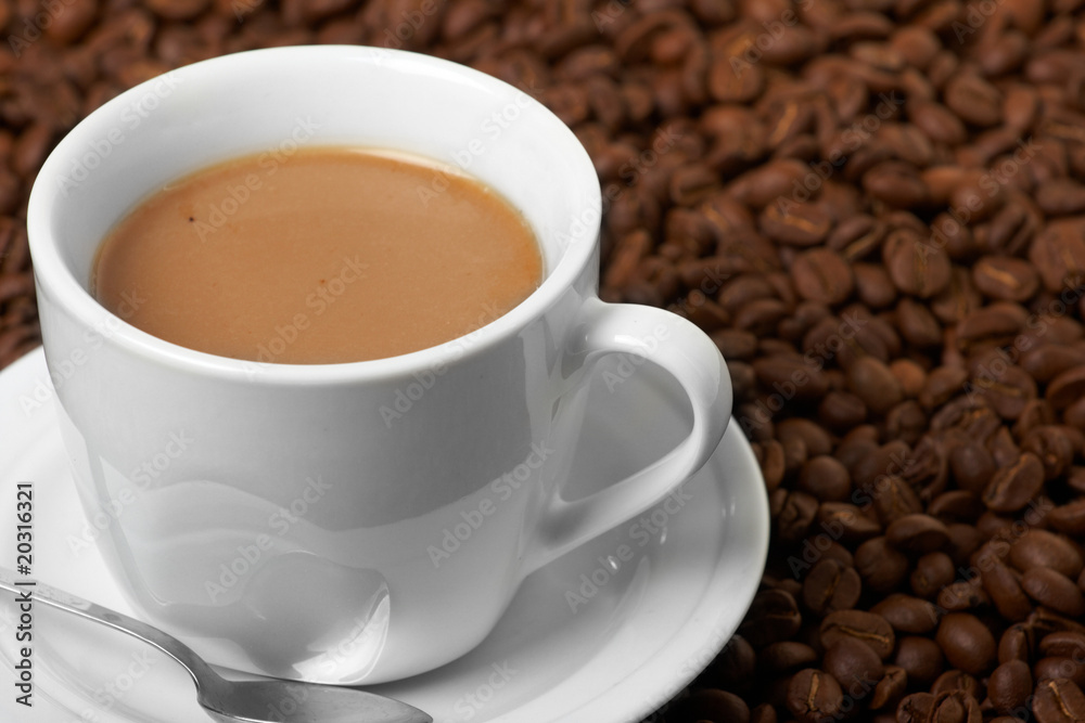Cup with coffee, costing on coffee grain Cup with coffee, costing on coffee grain