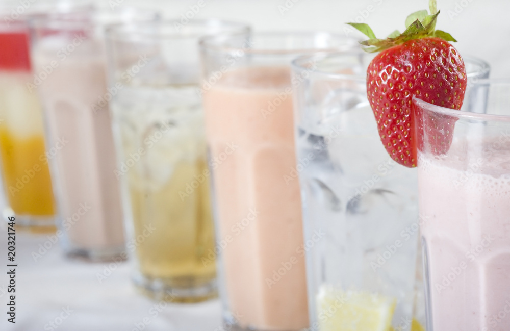Cold fresh fruit drinks in a row Cold fresh fruit drinks in a row