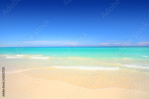 Idyllic beach with white sand and turquoise blue waters