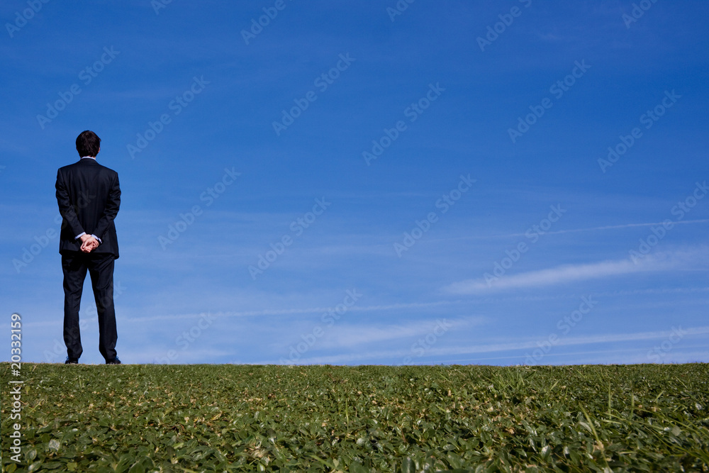 Business man on a hillside Business man on a hillside