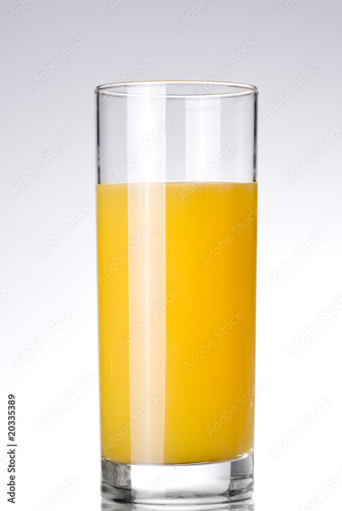 glass of orange juice on white glass of orange juice on white