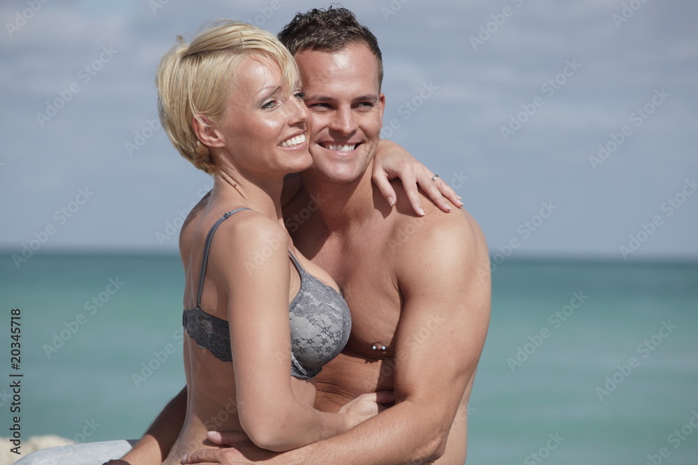 Attractive young couple smiling outdoors