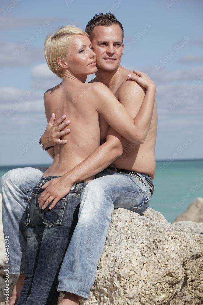 Attractive yougn couple holding each other Attractive yougn couple holding each other