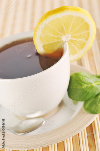 full cup of tea with lemon