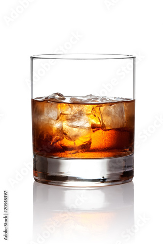 Glass of scotch whiskey and ice with clipping path