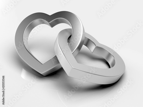 Silver hearts on white background