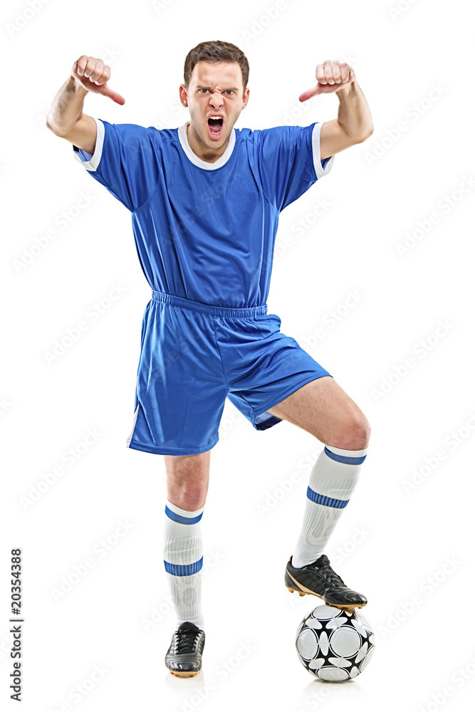 An angry soccer player shouting and giving thumbs down