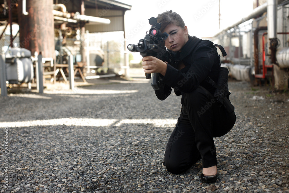 Sexy woman aiming rifle Stock Photo | Adobe Stock