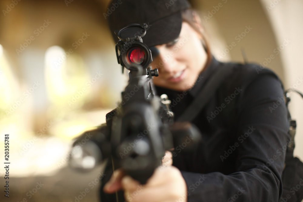 Sexy woman aiming rifle Sexy woman aiming rifle