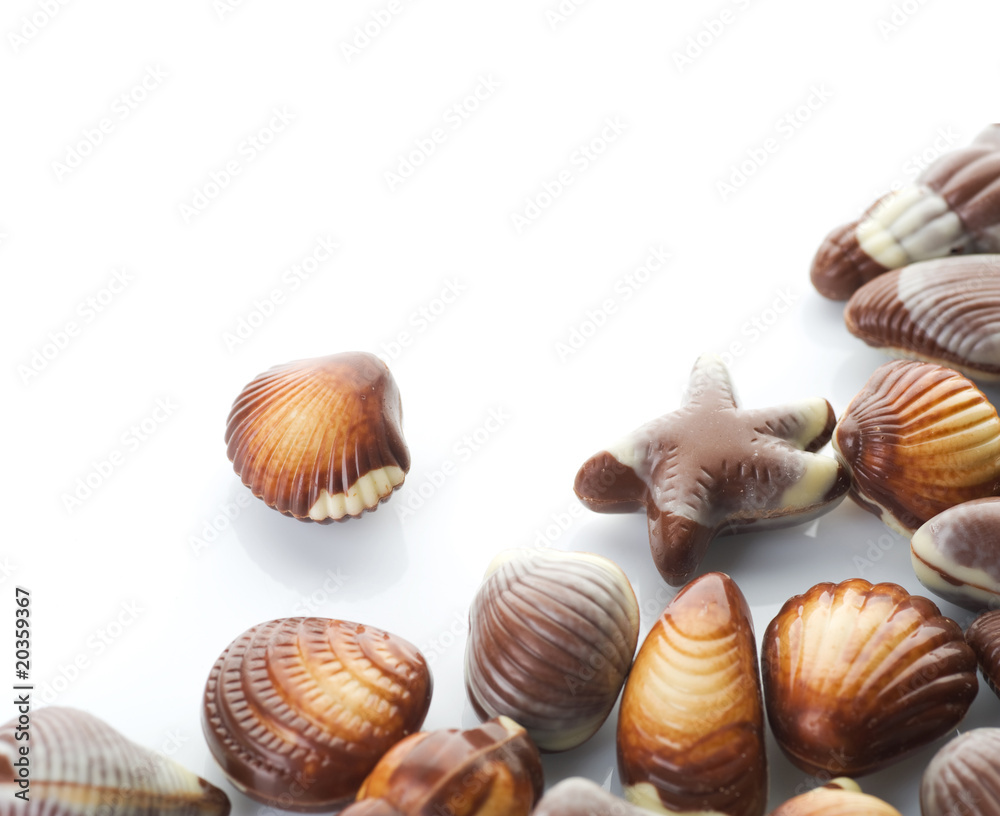 Chocolate Seashells border.Isolated on white Chocolate Seashells border.Isolated on white