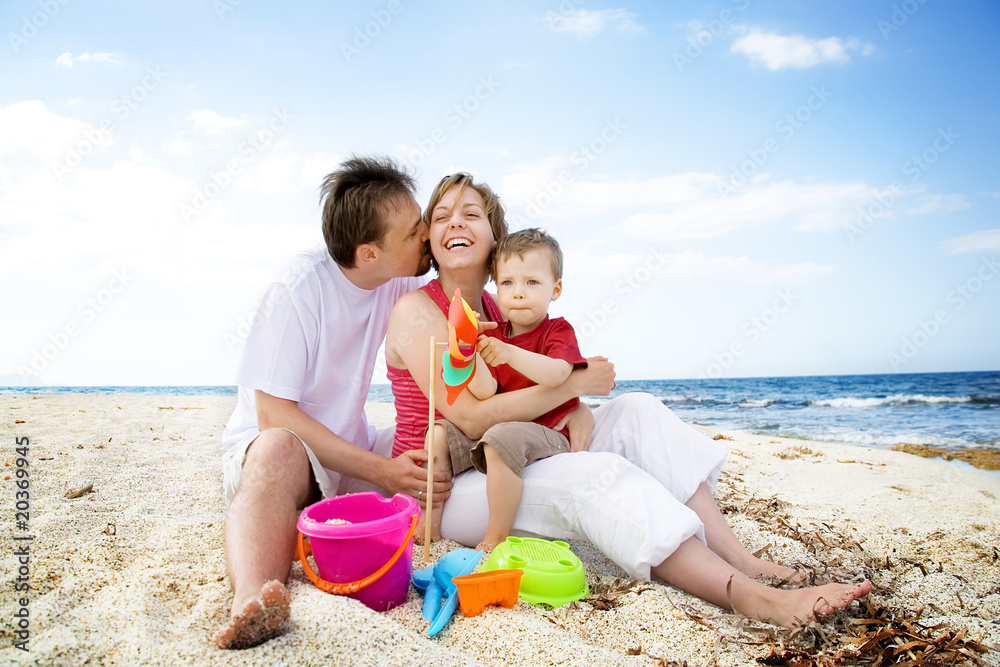 Happy family having fun on the beach. Happy family having fun on the beach.