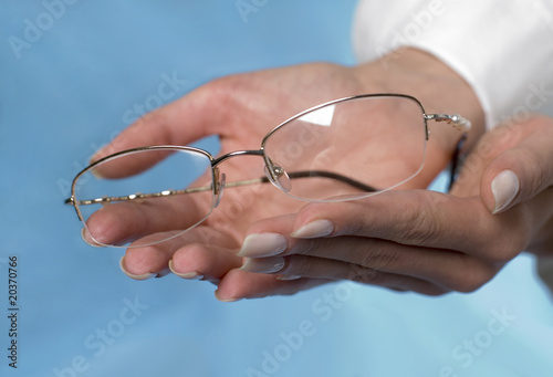 Glasses in the female hands