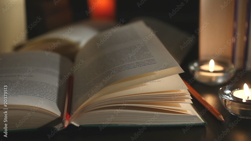 Books and candles camera moving left