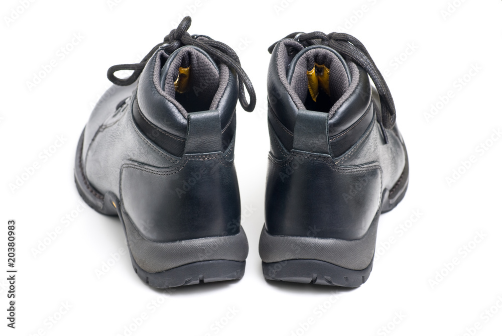 Naklejka premium Black leather boots. Isolated on white background.