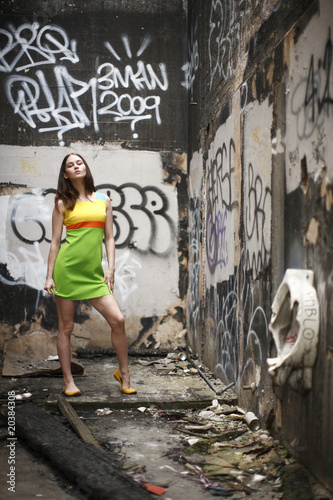 Young fashionable woman in abandoned building