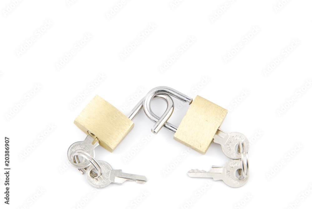 Two golden padlocks and keys on white Two golden padlocks and keys on white