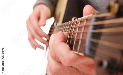 Close up of guitarist hand playing guitar