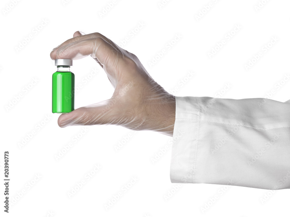 Fototapeta premium Green vial on a hand