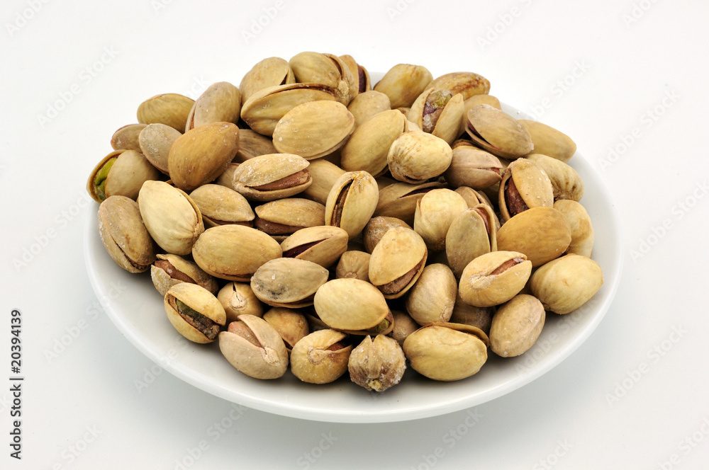 Pistachio appetizer on white plate Pistachio appetizer on white plate