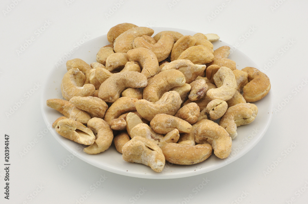 Indian nuts on white plate Indian nuts on white plate