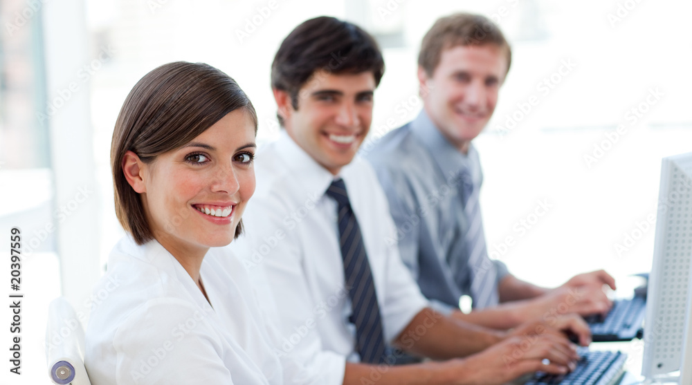 Enthusiastic business people working at computers Enthusiastic business people working at computers