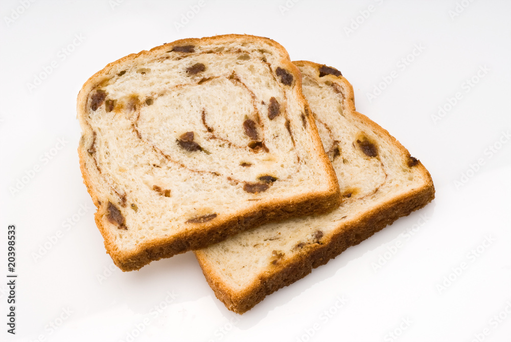 two slices of cinnamon raisin bread isolated with clipping path two slices of cinnamon raisin bread isolated with clipping path