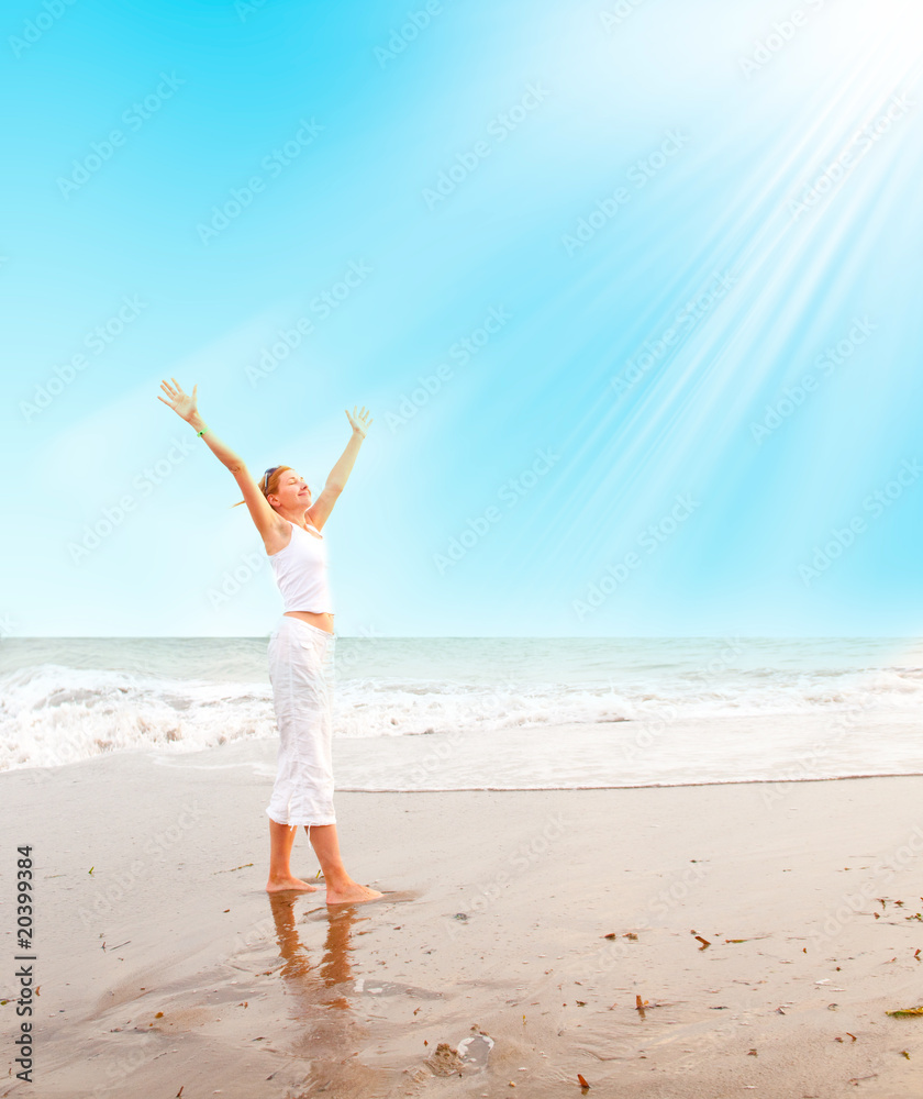 happy young woman is jumping in the beach happy young woman is jumping in the beach