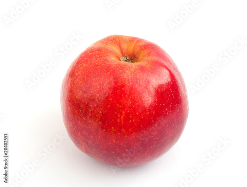 One is yellow - a red apple with a shank on a white background