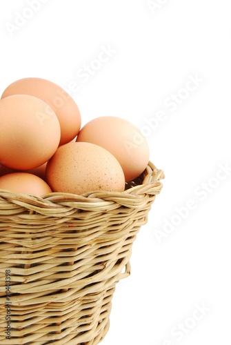 Wallpaper Mural Close-up of eggs in a wicker basket on white Torontodigital.ca