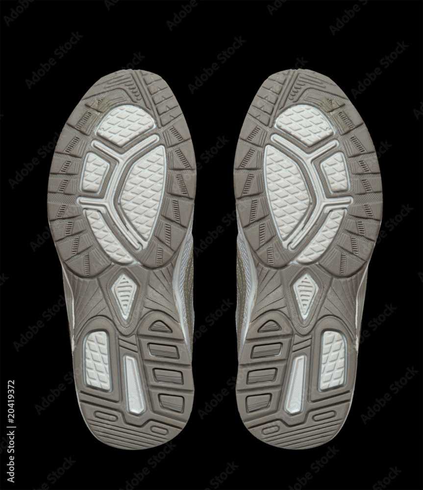 Pair of sneakers isolated on black background Pair of sneakers isolated on black background
