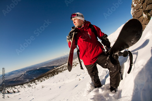 skier on a top over blue sky