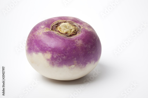 One whole single purple topped turnip on white background