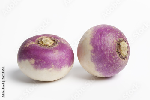 Twopurple topped turnips on white background photo