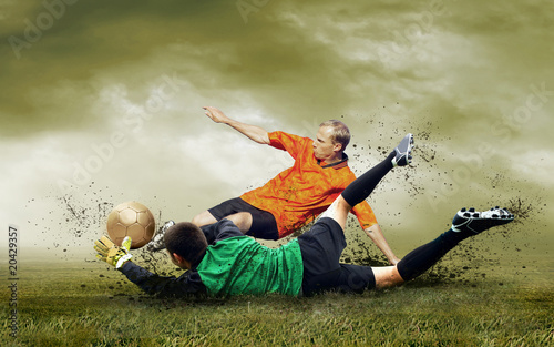 Outdoors: Shoot of football player and jump of goalkeeper