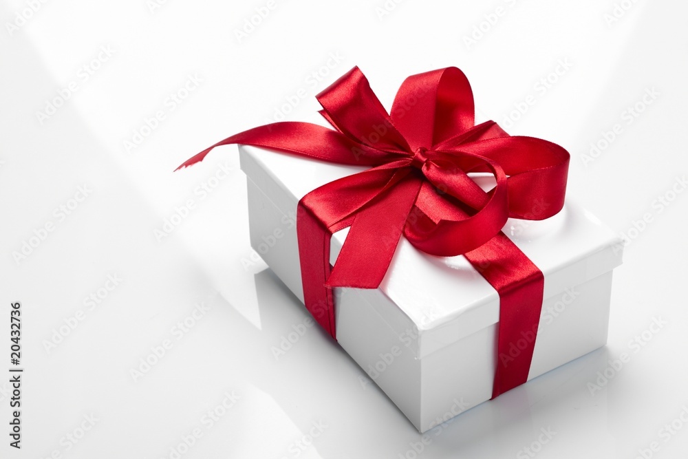 Fototapeta premium Gift decorated with a tape and a bow