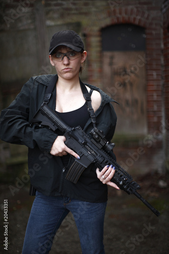 Female police officer with gun