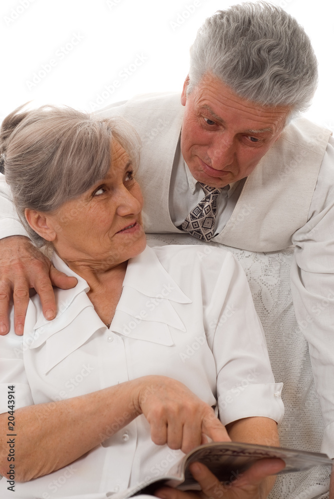 man and woman looking magazine white background man and woman looking magazine white background