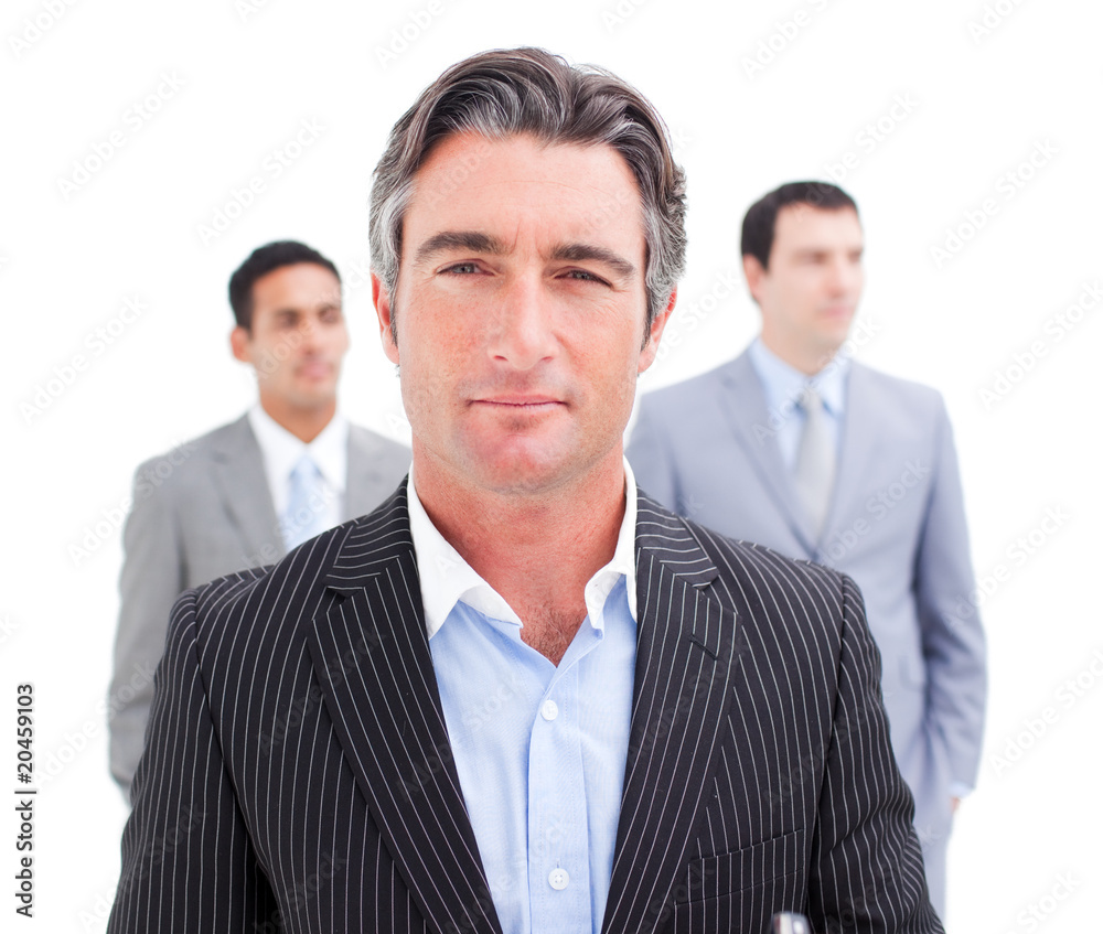 Charming businessman posing in front of his team Charming businessman posing in front of his team